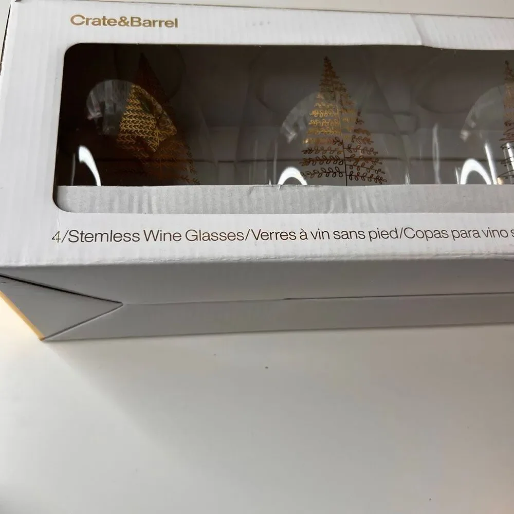 Crate & Barrel boxed set of 4 stemless wine glasses featuring a holiday tree des